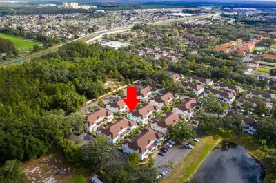an aerial view of a house with a red arrow on it at Lucaya Village Resort - 4 Bed 3 Bath Townhouse in Kissimmee