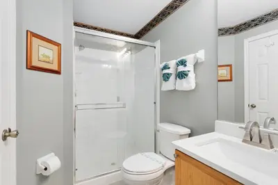 a bathroom with a shower and a toilet and a sink at Amazing Disney Dream Getaway in Windsor Palms! in Kissimmee