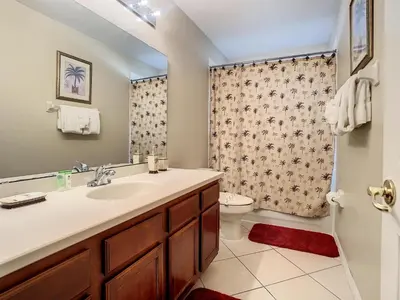 a bathroom with a sink and a toilet at Fantastic 7 Bed 6 Bath in Prestigious Gated Comm. in Orlando