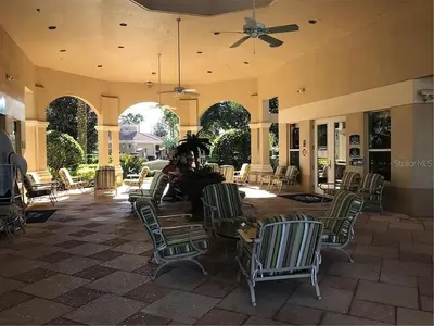 a lobby with chairs and a table and a ceiling at Three BR * 2 Miles to Disney, pool, free WiFi in Orlando