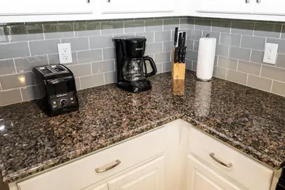 a kitchen counter with a coffee maker and a blender at Amazing 4 bedroom house near Disney in Kissimmee