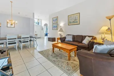 a living room with a couch and a table at 3Br 2Ba Private Pool Villa just steps away from villa in Kissimmee