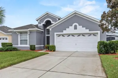 a house with a white garage door at 3Br 2Ba Private Pool Villa just steps away from villa in Kissimmee