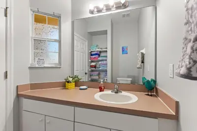 a bathroom with a sink and a mirror at Zen Escape At Terra Verde By Shine Villas in Kissimmee