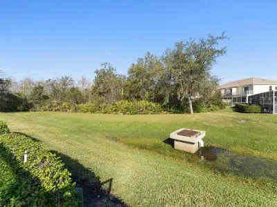 a bench sitting in the middle of a yard at Priceless Peace At Serenity By Shine Villas 081 in Orlando