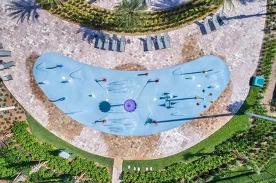 an overhead view of a swimming pool with people on it at Plush Pelican, At Storey Lake By Shine Villas #839 in Kissimmee