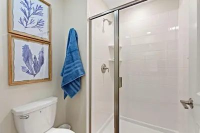 a bathroom with a shower and a toilet at Plush Pelican, At Storey Lake By Shine Villas #839 in Kissimmee