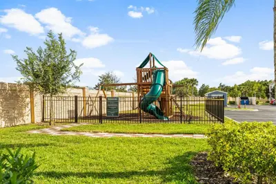 a playground with a slide in a park at Lucky Find Lucaya Resort By Shine Villas 713 in Kissimmee