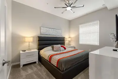 a bedroom with a bed and a ceiling fan at Fireworks Night -Storey Lake By Shine Villas #709 in Kissimmee