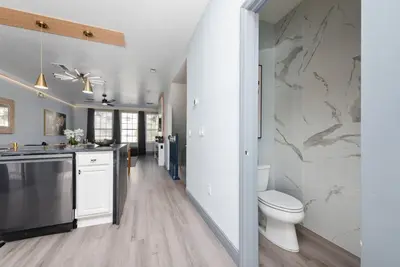 a bathroom with a toilet and a sink at Prime Location 3 Suites Townhome Near Universal in Orlando