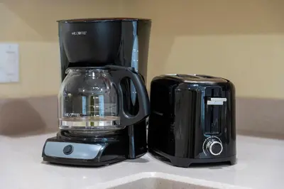 a coffee maker and a toaster on a counter at Luxury 3-Suite Townhome Resort Near Universal in Orlando