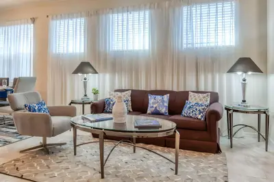 a living room with a couch and a table at DLuxx Summer Vacation Home at Solterra Resort 7391 in Orlando