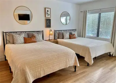 two beds sitting next to each other in a bedroom at Universal-Disney Dream 1211 Studio - The Enclave in Orlando