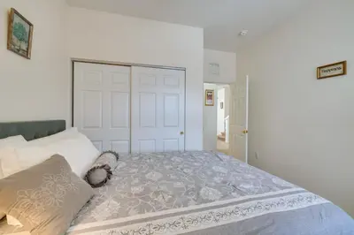 a bedroom with a bed with a large white door at 22 Mi to Disney Kissimmee Home with Pool and Hot Tub in Kissimmee