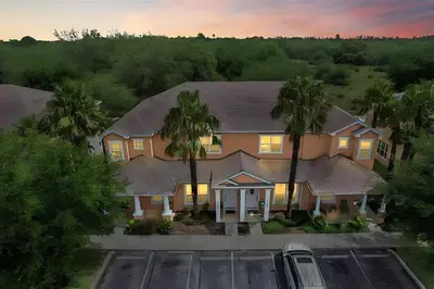 an aerial view of a house with palm trees at MEMO Vacation House in Orlando