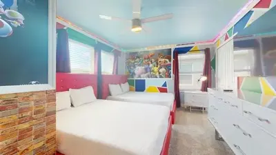 a bedroom with two twin beds in a room at 4323SL-Storey Lake Resort townhouse in Kissimmee