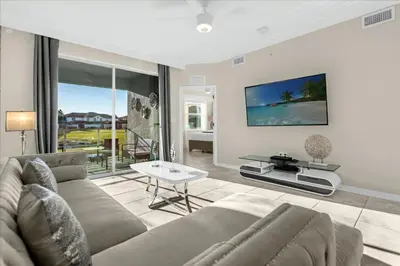 a living room with a couch and a table at 3 Bedrooms 2 Bathrooms Storey Lake 3111-101Pc in Kissimmee