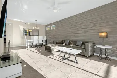 a living room with a couch and a table at 3 Bedrooms 2 Bathrooms Storey Lake 3111-101Pc in Kissimmee