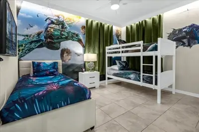 a bedroom with two bunk beds and a dragon mural at 3 Bedrooms 2 Bathrooms Storey Lake 3111-101Pc in Kissimmee