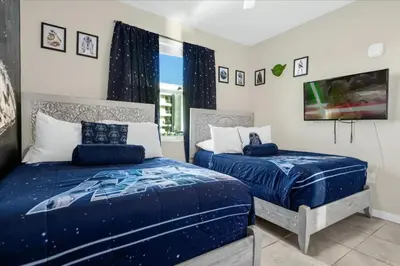 a bedroom with two beds and a window at 3 Bedrooms 2 Bathrooms Storey Lake 3111-101Pc in Kissimmee