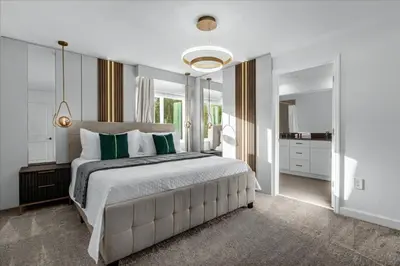 a bedroom with a large bed and a large mirror at 5 Bedrooms 4 Bathrooms Storey Lake 2533 Rt in Kissimmee