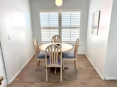 a dining room with a table and chairs at Brittany - Perfect 3 BR Pool Home in Kissimmee