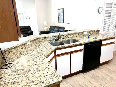 a kitchen with a sink and a counter top at Brittany - Perfect 3 BR Pool Home in Kissimmee