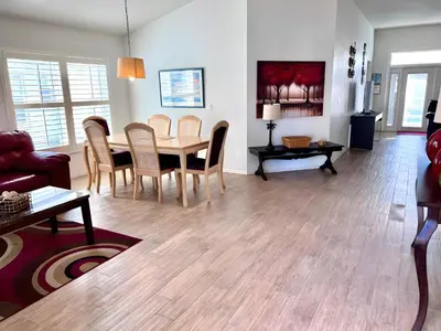 a living room with a dining room table and chairs at Brittany - Perfect 3 BR Pool Home in Kissimmee