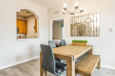 a dining room with a wooden table and chairs at Near Pool*Balcony*VistaCay Convention Ctr & Idrive in Orlando