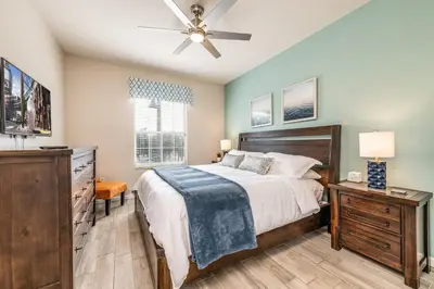 a bedroom with a bed and a ceiling fan at Near Pool*Balcony*VistaCay Convention Ctr & Idrive in Orlando