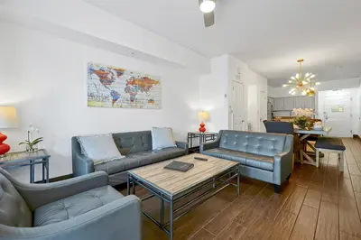 a living room with two blue couches and a table at International Drive Luxury Condo in Orlando