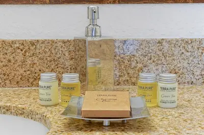 a box sitting on a counter next to jars of paint at International Drive Luxury Condo in Orlando