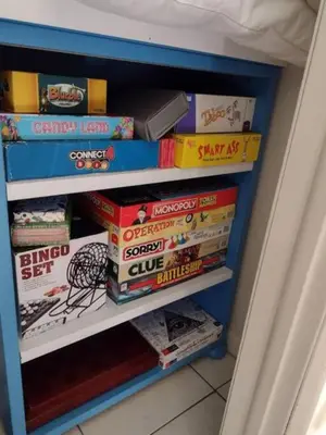 a book shelf filled with lots of books at House of Blues-3 Bedrooms+GameRoom in Orlando
