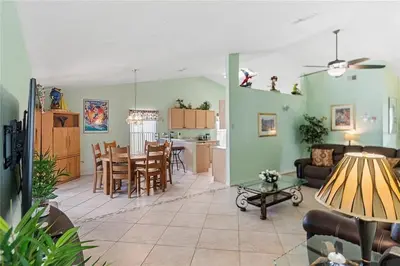 a living room with a couch and a table at 1589-IBRHAIM · Charming new 4bd in the heart of Kissimmee 1589 in Orlando
