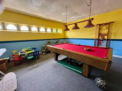 a play room with a pool table in it at 1589-IBRHAIM · Charming new 4bd in the heart of Kissimmee 1589 in Orlando