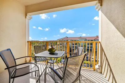 a balcony with a table and chairs on a balcony at Top Floor*Balcony*VistaCay Convention Ctr & Idrive in Orlando