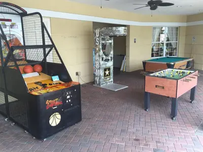 a room with several games and a table at Top Floor*Balcony*VistaCay Convention Ctr & Idrive in Orlando