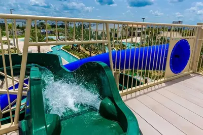 a water slide on a balcony at a resort at Lovely Family Home - 10min to Disney - STL107 in Kissimmee
