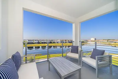a balcony with benches and a view of the water at 3141-307DM STOREY LAKE, CONDO 2/2 LAKE VIEW in Kissimmee