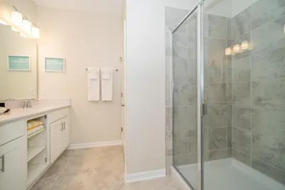a bathroom with a shower stall and a sink at 3141-405IL STOREY LAKE, CONDO 2/2 LAKE VIEW in Kissimmee
