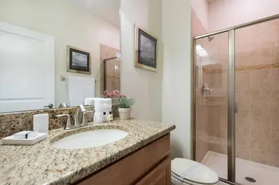 a bathroom with a sink and a shower at Last Minute Disney Getaway! Private Pool, Hot Tub & Games Room. Book Now! #17074 in Kissimmee