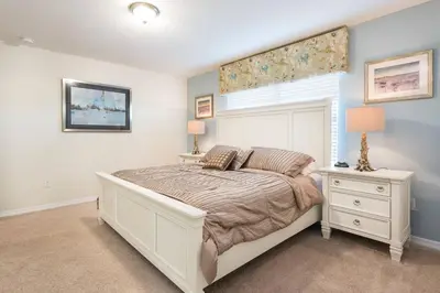 a bedroom with a large bed and a window at Last Minute Disney Getaway! Private Pool, Hot Tub & Games Room. Book Now! #17074 in Kissimmee