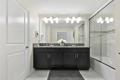 a bathroom with a black sink and a mirror at Last Minute Disney Getaway Private Pool Themed Bedrooms. Book Now 17142 in Kissimmee