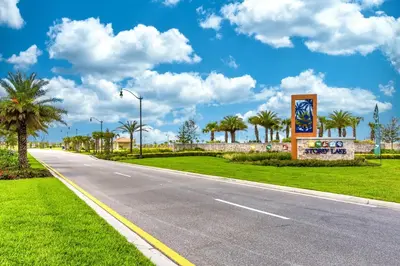an empty road with palm trees on the side at Last Minute Disney Getaway Private Pool Themed Bedrooms. Book Now 17142 in Kissimmee