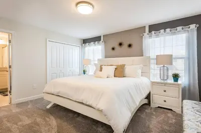 a bedroom with a large white bed and a window at Last Minute Disney Getaway Townhouse with Private Pool. Book Now 21174 in Kissimmee