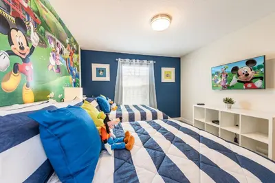 a bedroom with a bed with stuffed animals on it at Last Minute Disney Getaway Townhouse with Private Pool. Book Now 21174 in Kissimmee
