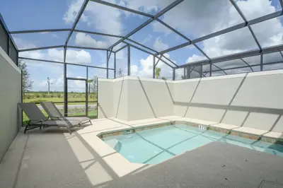 a swimming pool in a building with a glass ceiling at Last Minute Disney Getaway! Private Pool, Hot Tub & Games Room. Book Now! #17050 in Kissimmee
