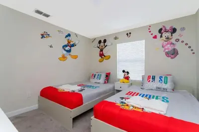 a bedroom with two twin beds and hello kitty decals at Roomy Family Home-Sleeps 16 STL110 in Kissimmee