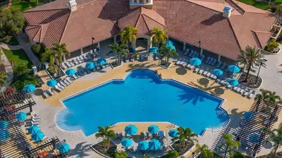 an overhead view of a swimming pool at a resort at Epic Location 3BR Home w Full Comfort in Orlando