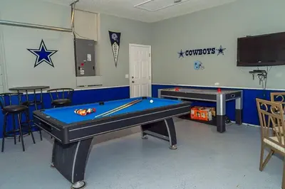 a billiard room with two pool tables and stars on the wall at 2025 Vacation Savings Secure Your Spot Today in Orlando